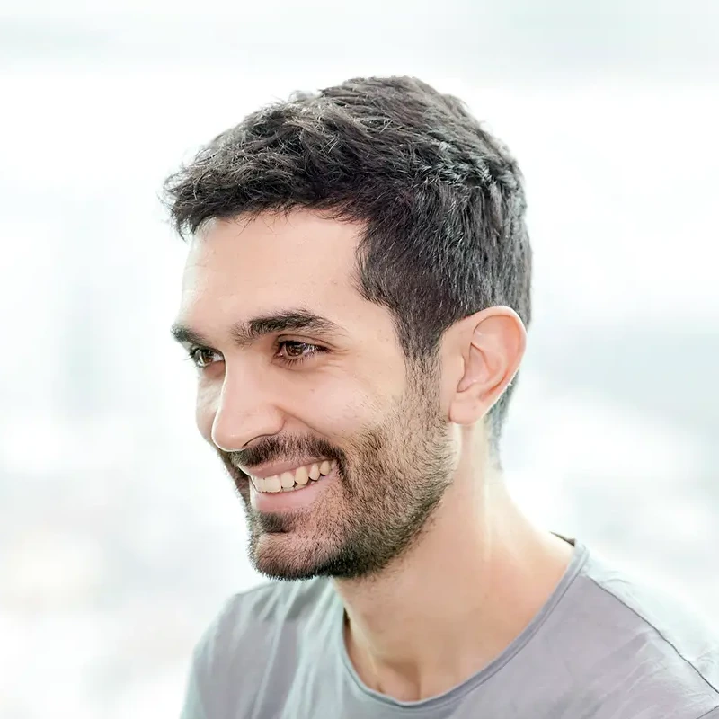 Tiago Ramalho (smiling, with beard and gray shirt)